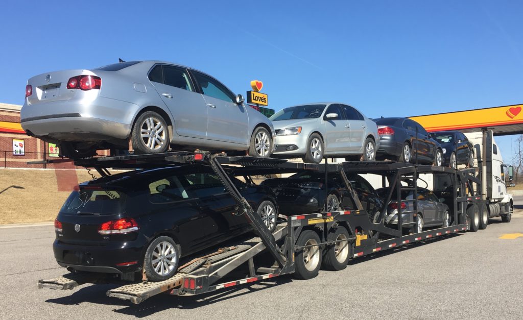 Vehicle transport truck heading to auction