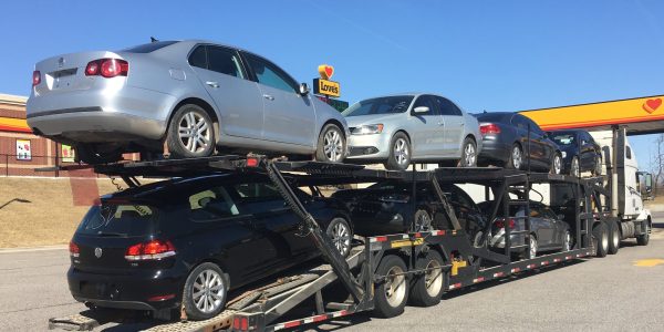 Vehicle transport truck heading to auction